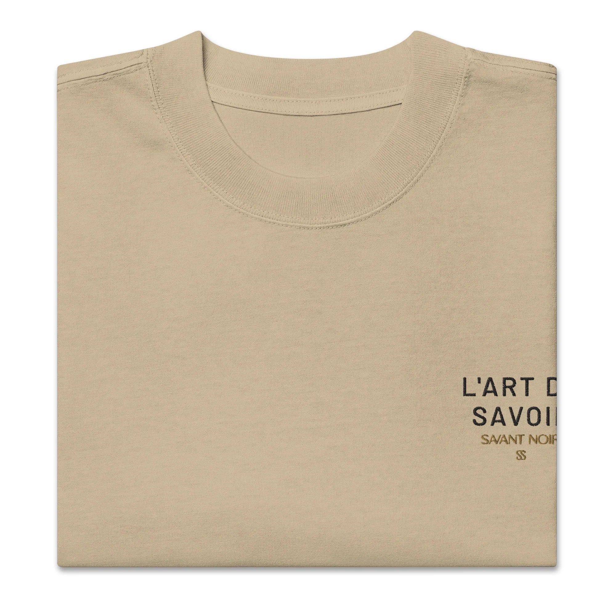 Beige luxury oversized streetwear tee by SAVANT NOIR with minimalist black text print on chest