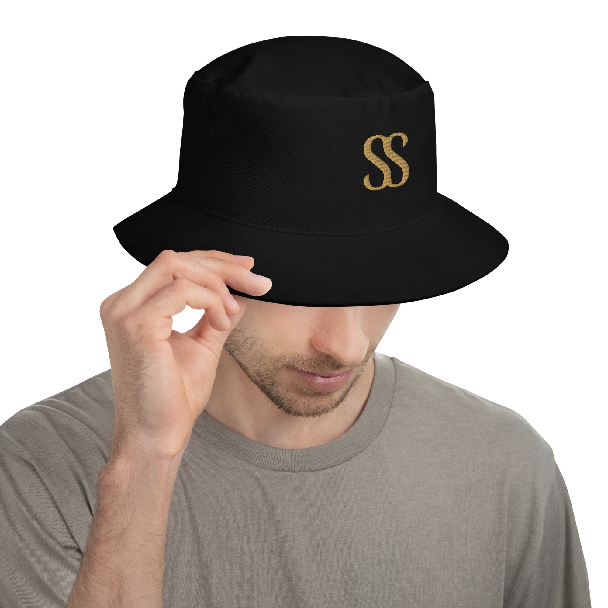 SAVANT NOIR luxury black bucket hat with gold SS logo worn by man in gray shirt