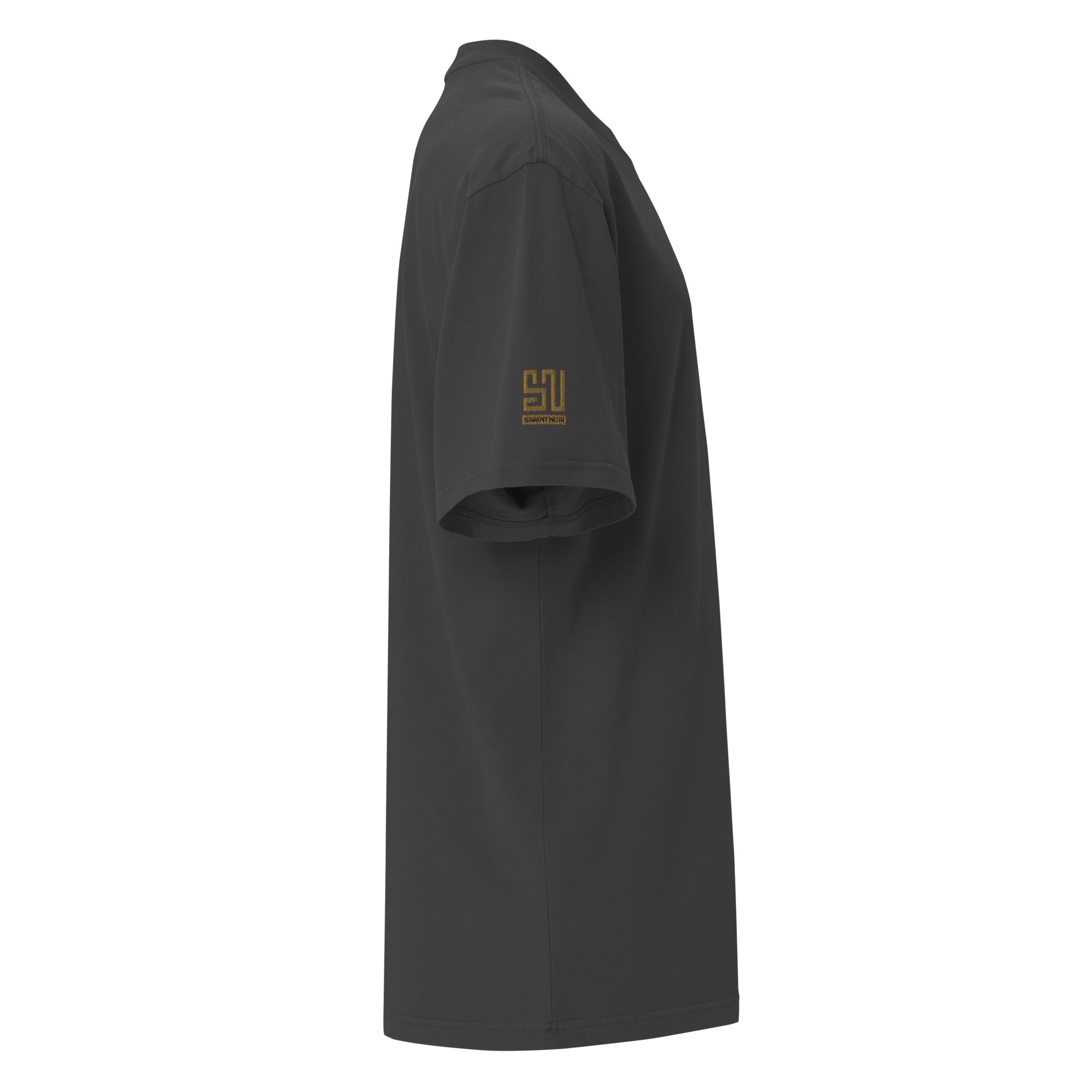 Side view of black luxury streetwear oversized tee with subtle gold SAVANT NOIR logo on sleeve