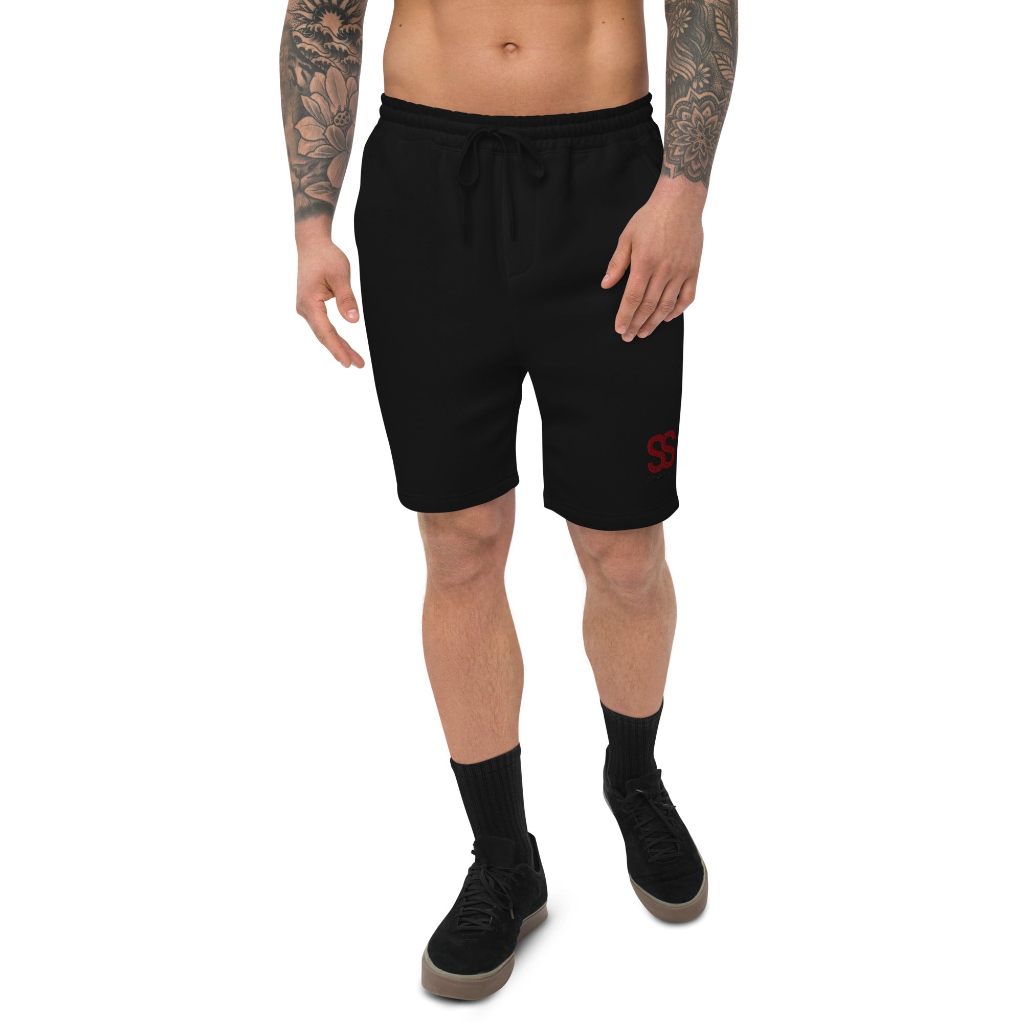 SAVANT NOIR luxury fleece shorts in black worn by a tattooed male model with drawstring waist