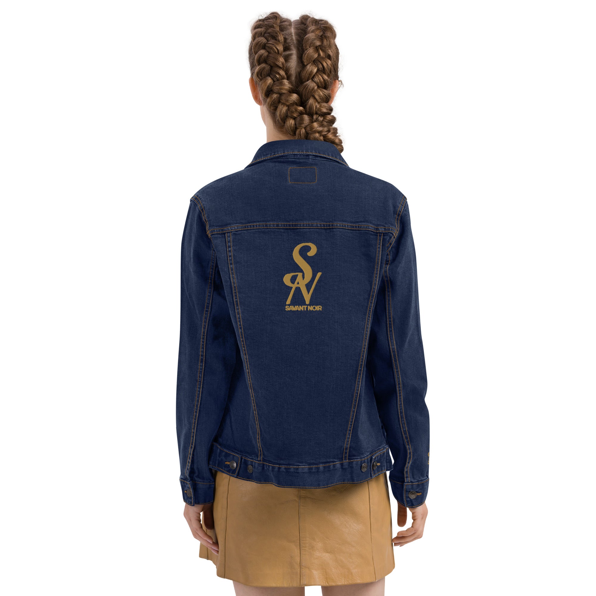 SAVANT NOIR luxury black denim jacket with gold logo on back worn by model with braided hair