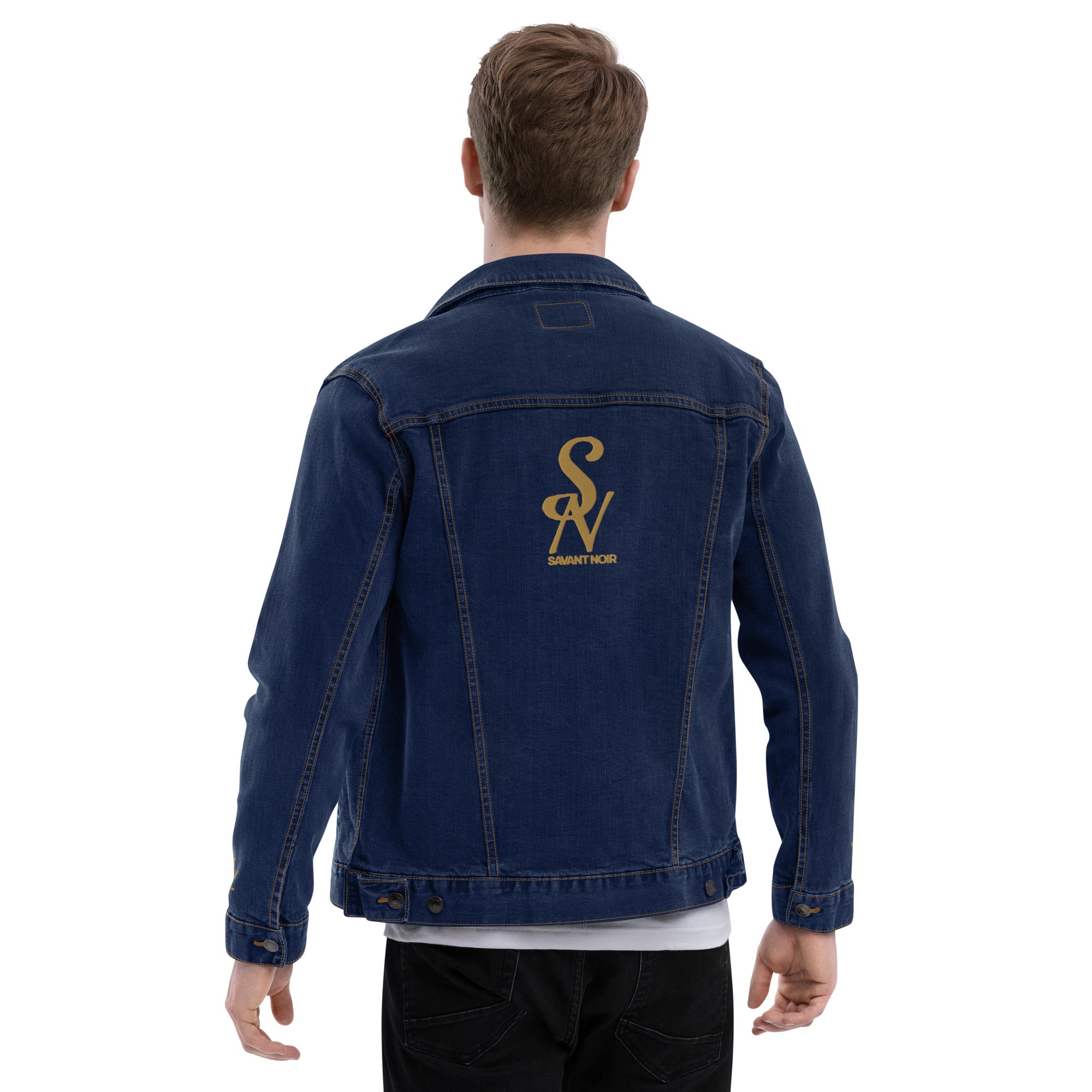 Back view of luxury black denim jacket by SAVANT NOIR worn by a male model with gold logo detail
