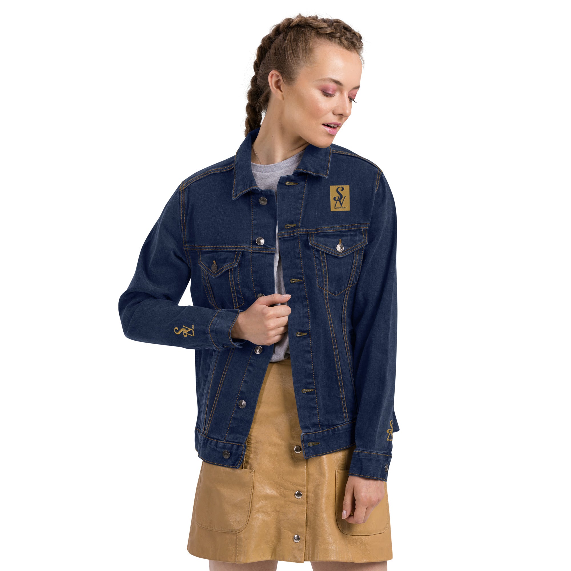 SAVANT NOIR luxury black denim jacket worn by model with tan buttoned skirt and white shirt