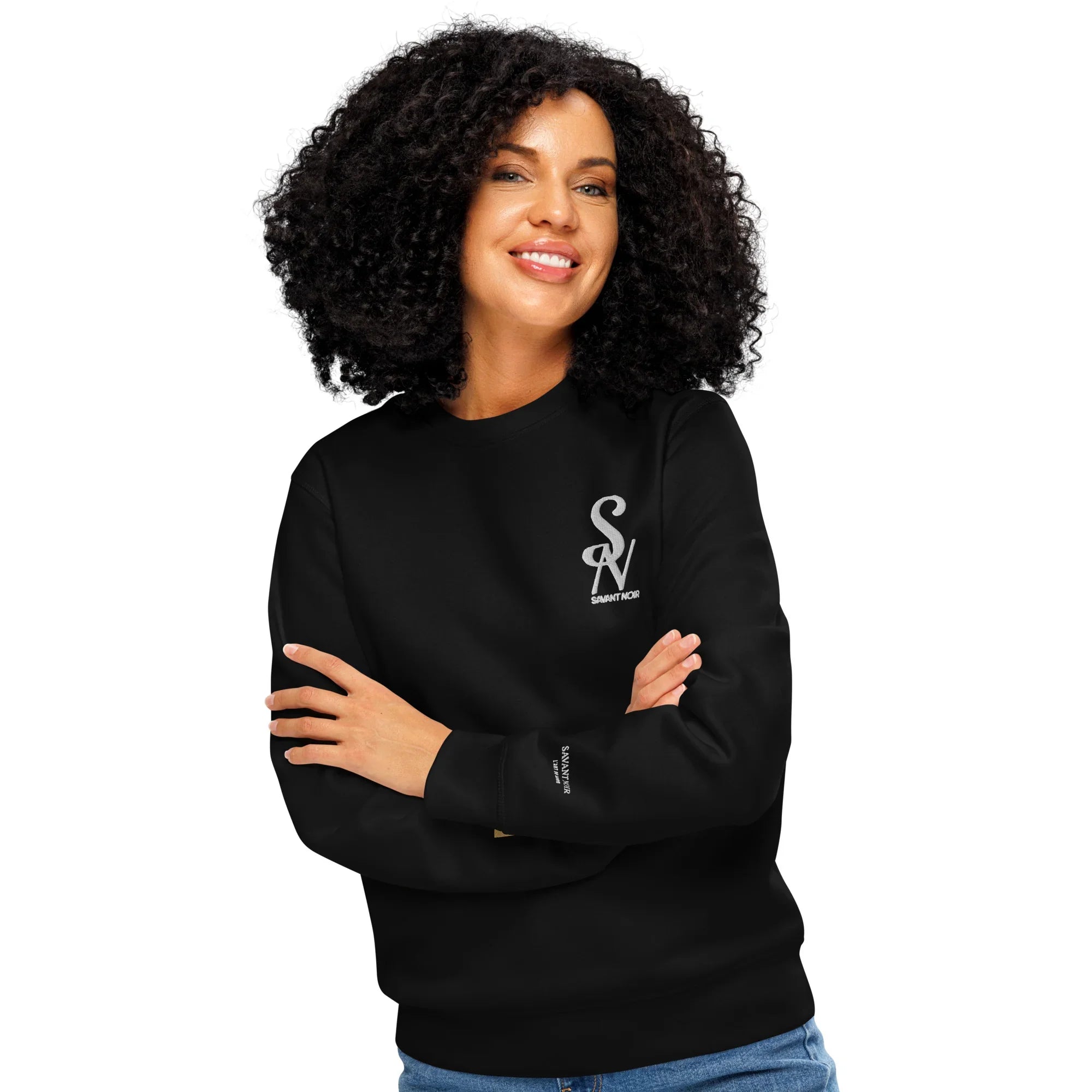 SAVANT NOIR luxury black crewneck sweatshirt worn by smiling woman with curly hair
