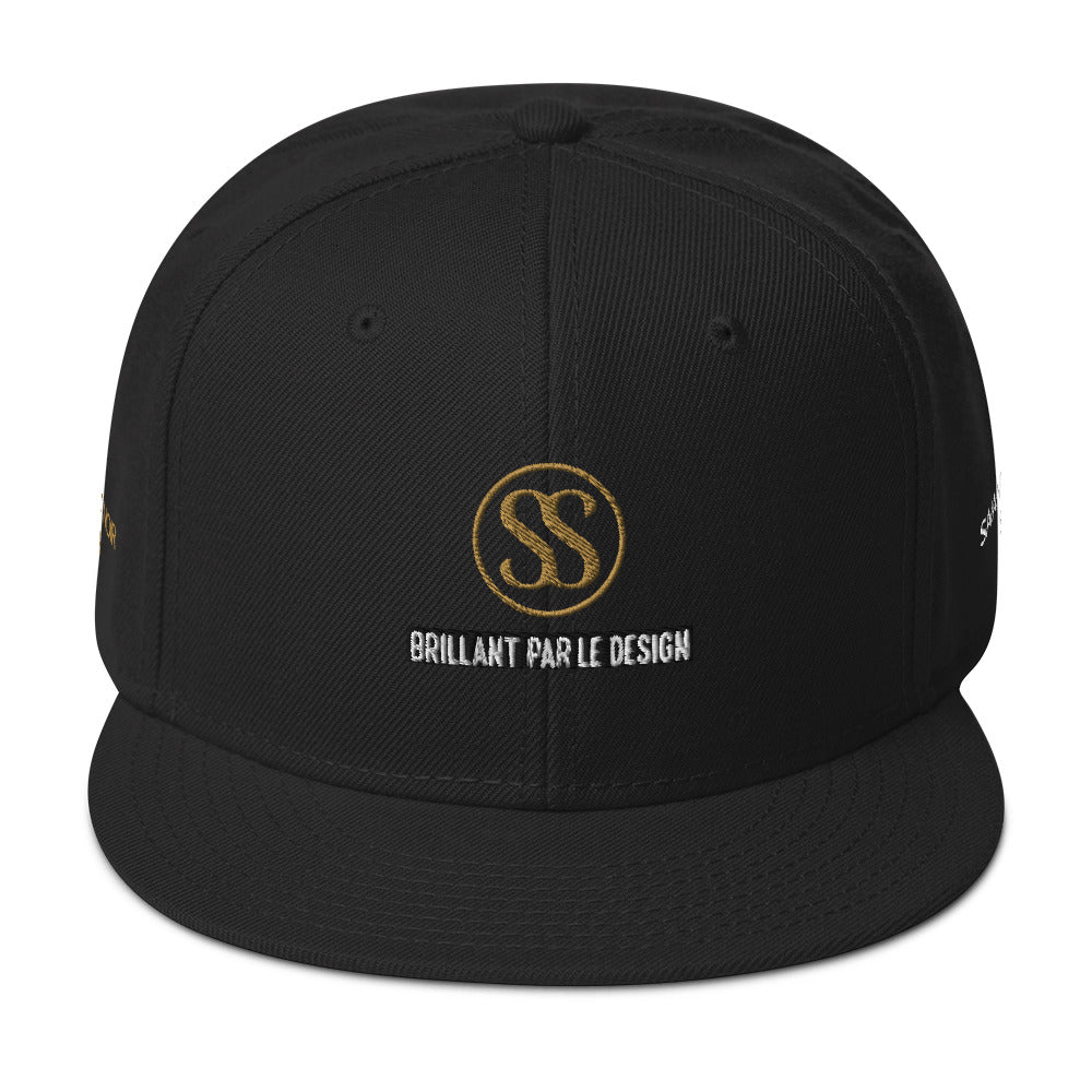 Luxury black snapback hat by SAVANT NOIR with gold logo and Brillant Par Le Design embroidery