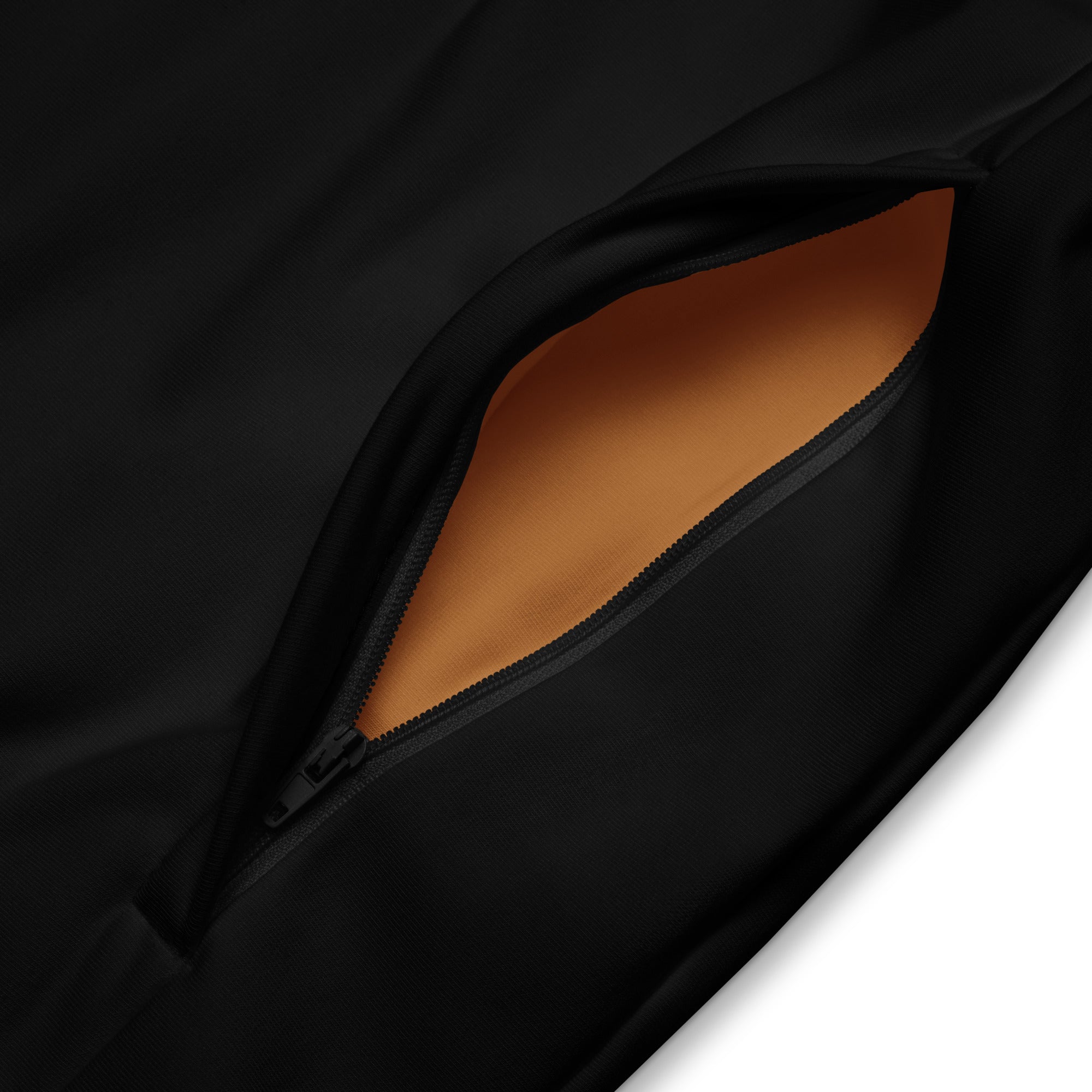 Close-up of luxury black track jacket zipper pocket with contrasting inner lining by SAVANT NOIR