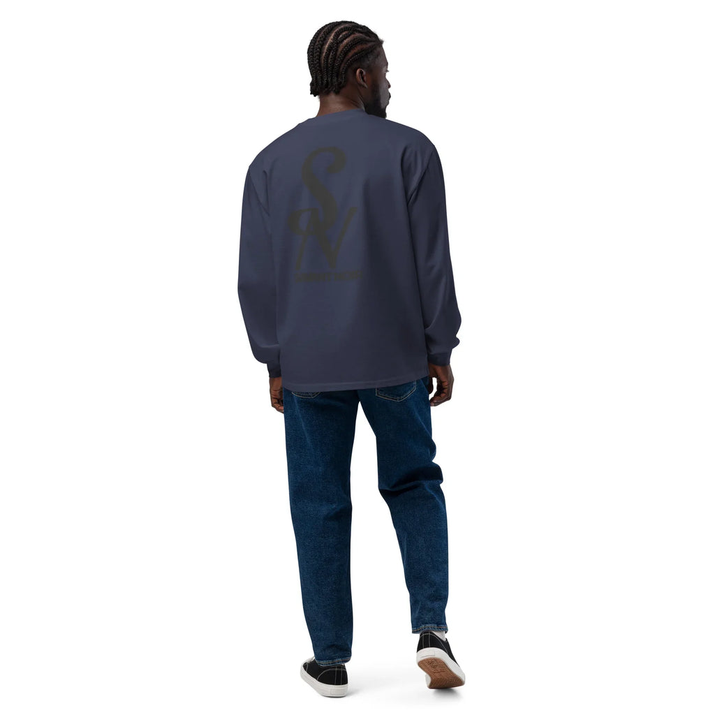Man wearing SAVANT NOIR luxury long sleeve shirt in dark color paired with blue jeans and sneakers