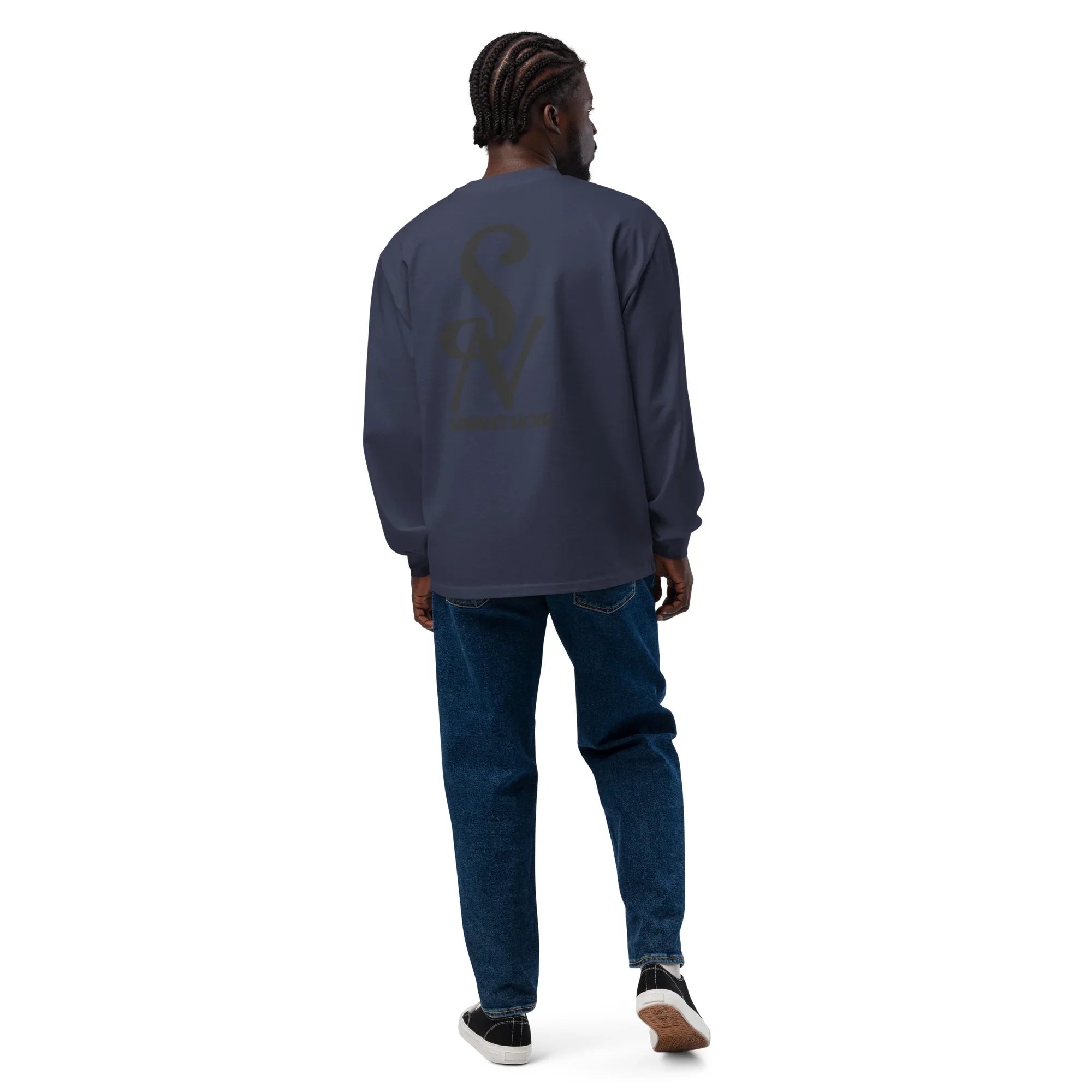 Man wearing SAVANT NOIR luxury long sleeve shirt in dark color paired with blue jeans and sneakers