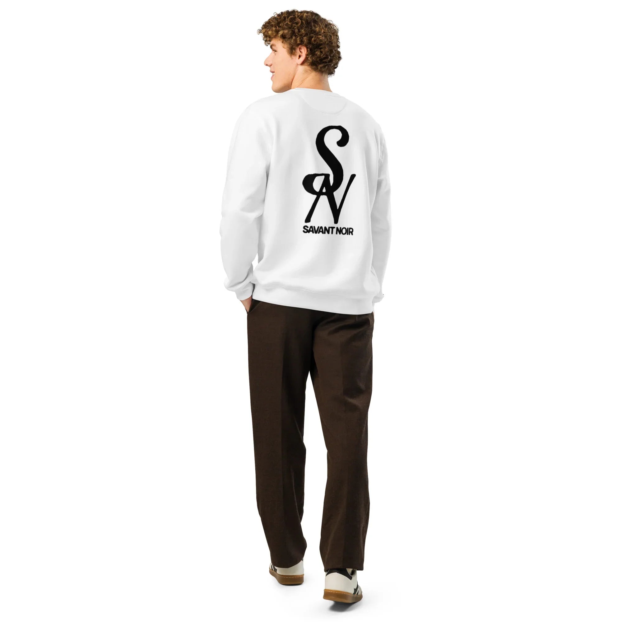 Man wearing white luxury midweight crewneck sweatshirt with Savant Noir logo on back
