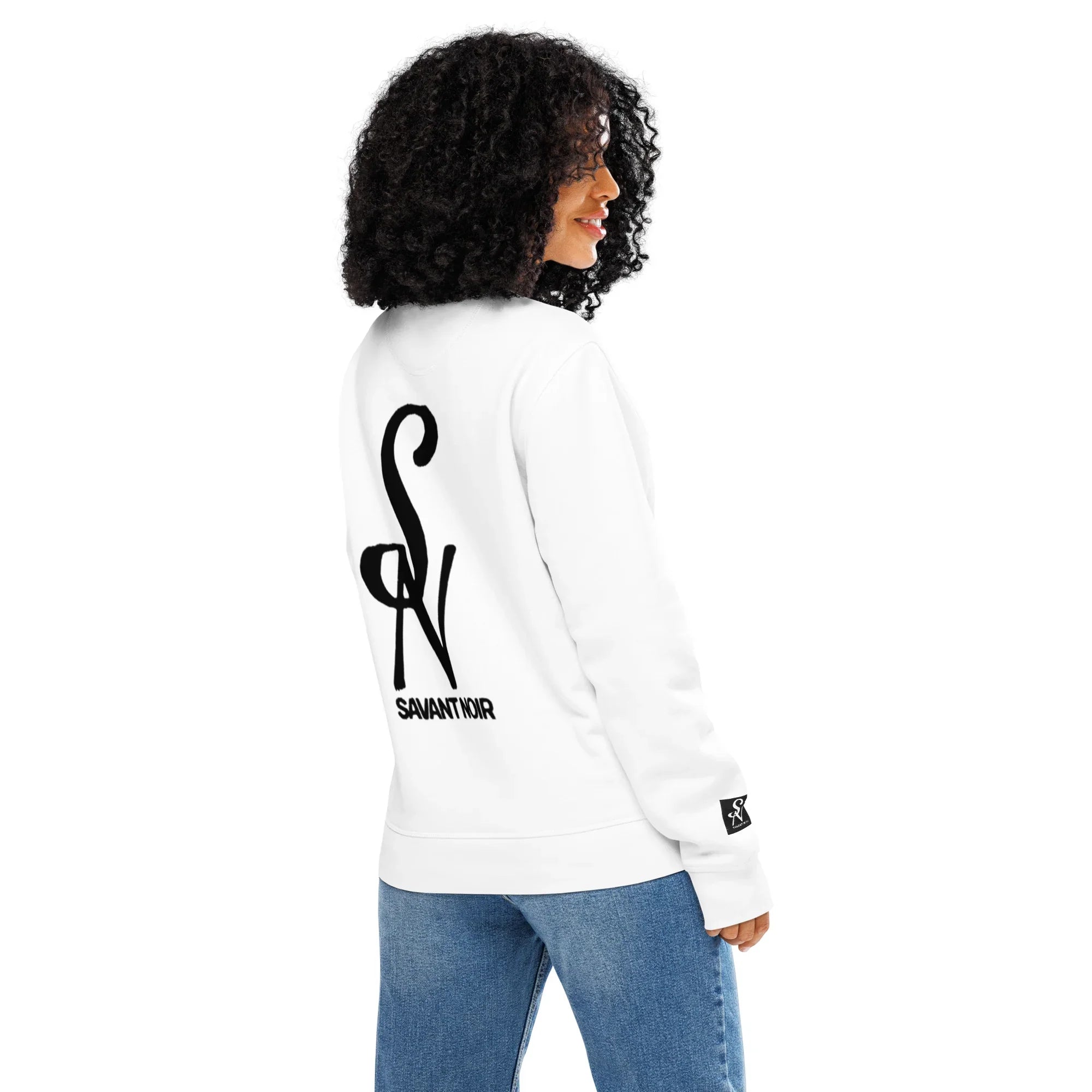 SAVANT NOIR luxury midweight crewneck sweatshirt in white with black logo on back worn by woman with curly hair