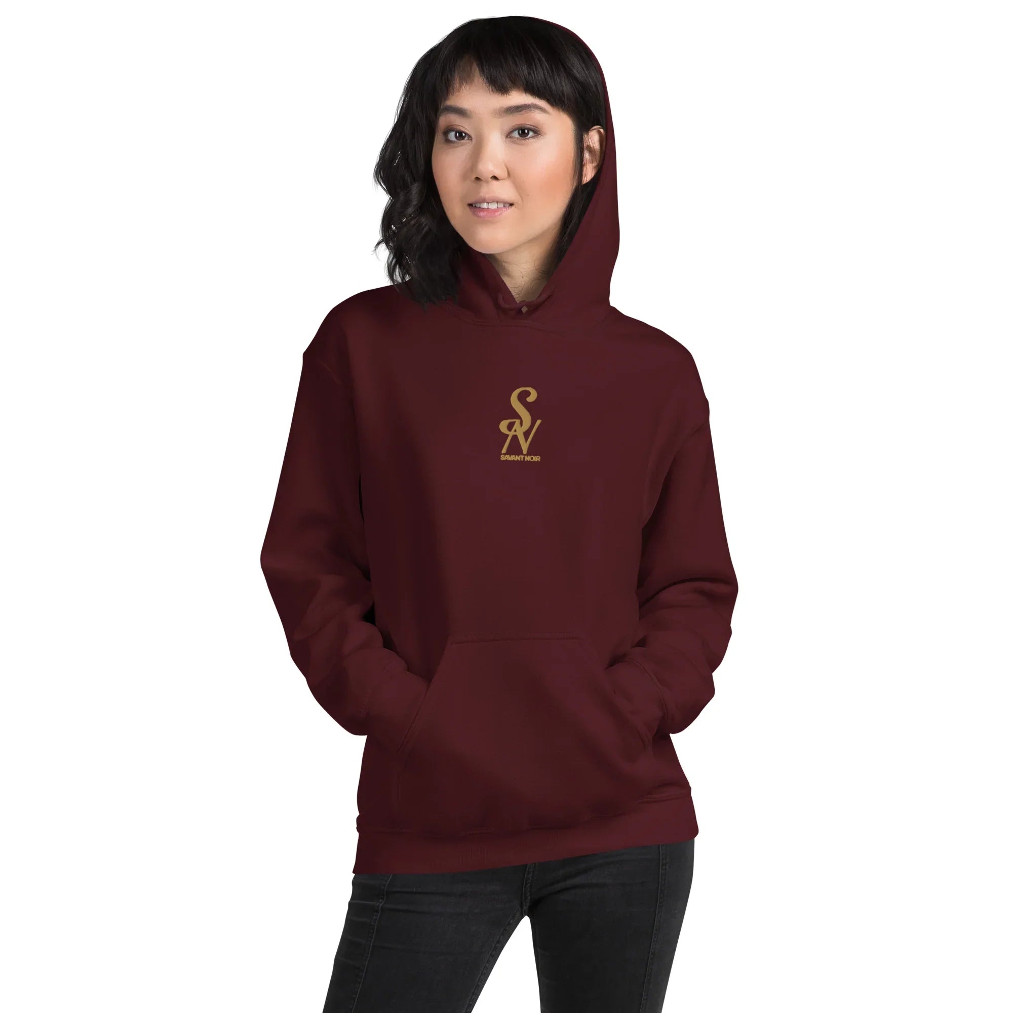 SAVANT NOIR luxury minimalist hoodie in deep burgundy with gold logo worn by woman