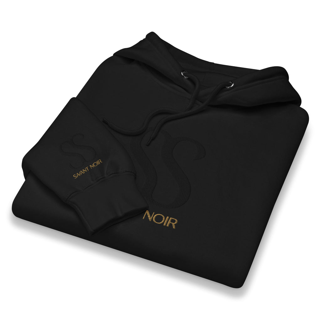 Savant Noir black luxury streetwear hoodie with subtle logo and gold lettering folded neatly