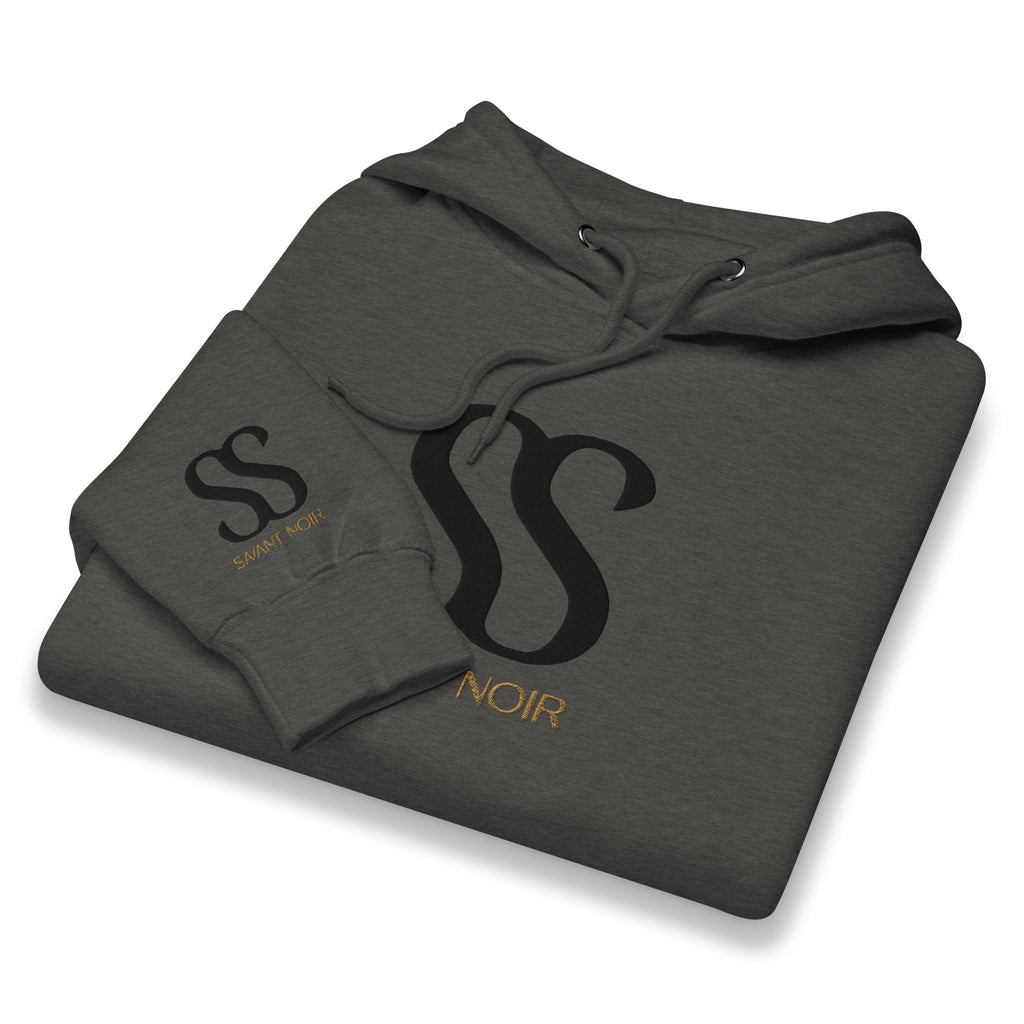 Folded gray luxury streetwear hoodie by SAVANT NOIR with black and gold logo print on front and sleeve