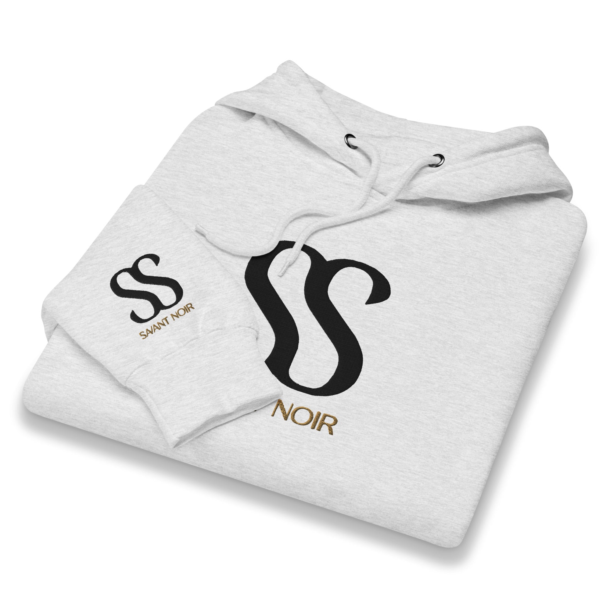 Folded white SAVANT NOIR luxury streetwear hoodie with black and gold logo design