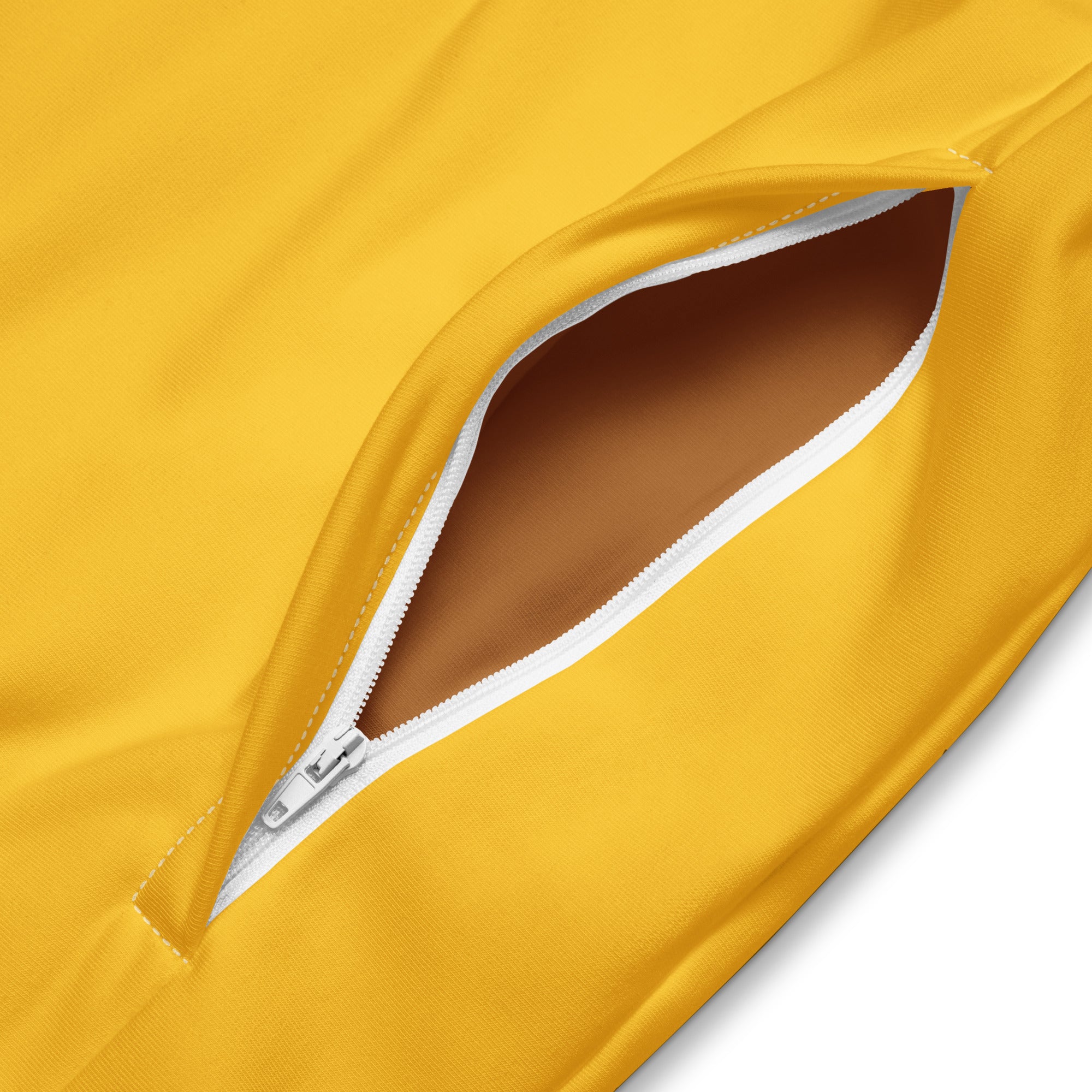 Close-up of white zipper on yellow luxury track jacket sleeve by SAVANT NOIR
