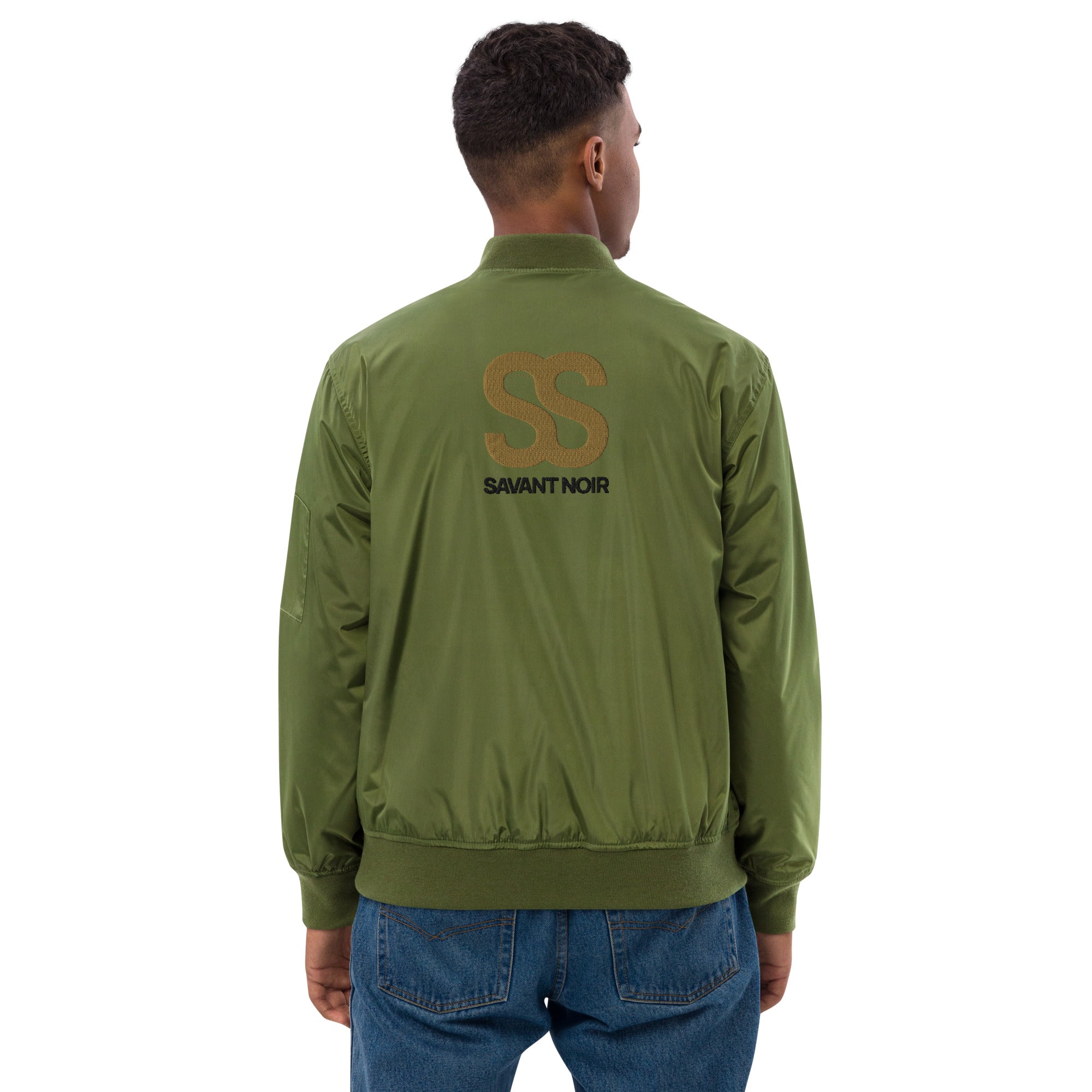 Back view of a man wearing a designer olive bomber for men by SAVANT NOIR with logo print