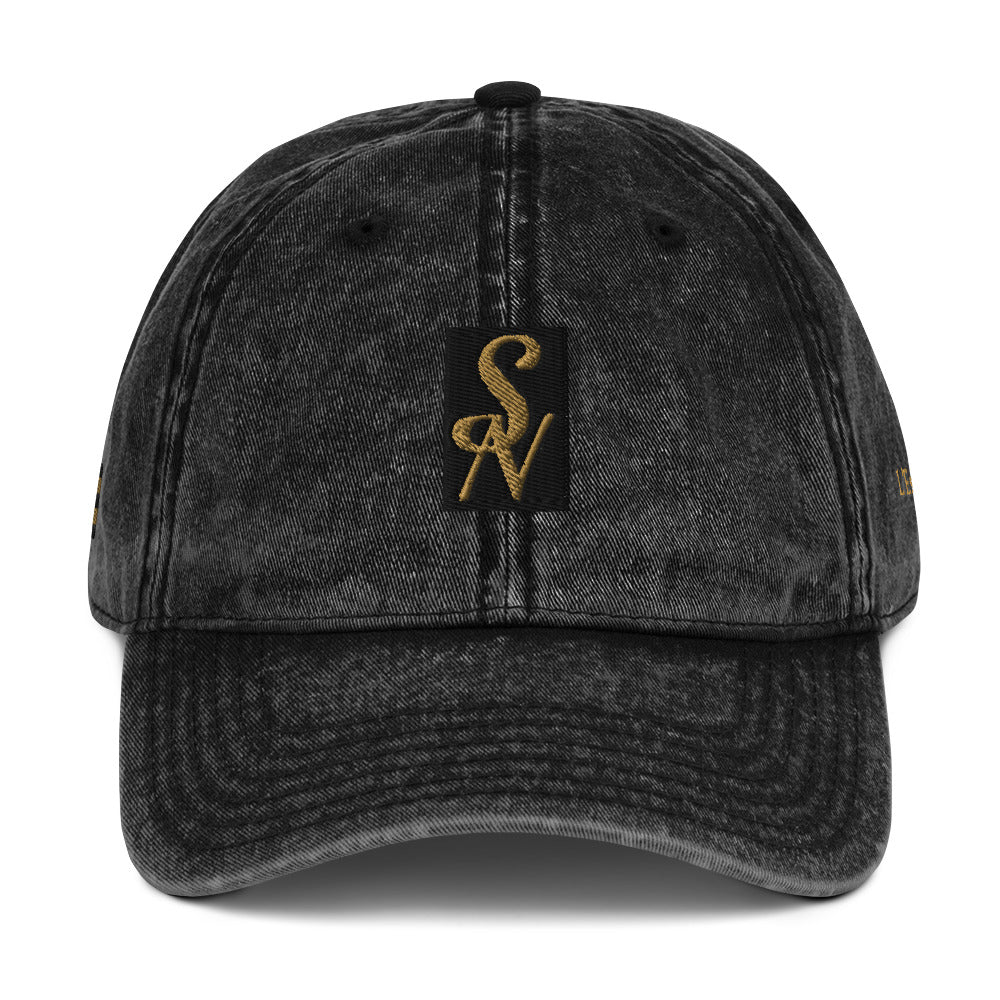 SAVANT NOIR vintage cotton twill cap in washed black with gold embroidered logo on front