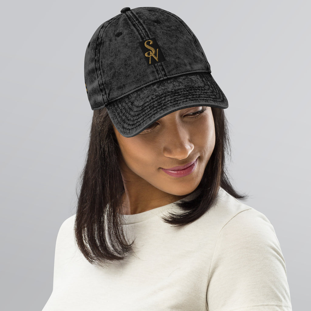 Woman wearing vintage cotton twill cap in black with SAVANT NOIR logo embroidery