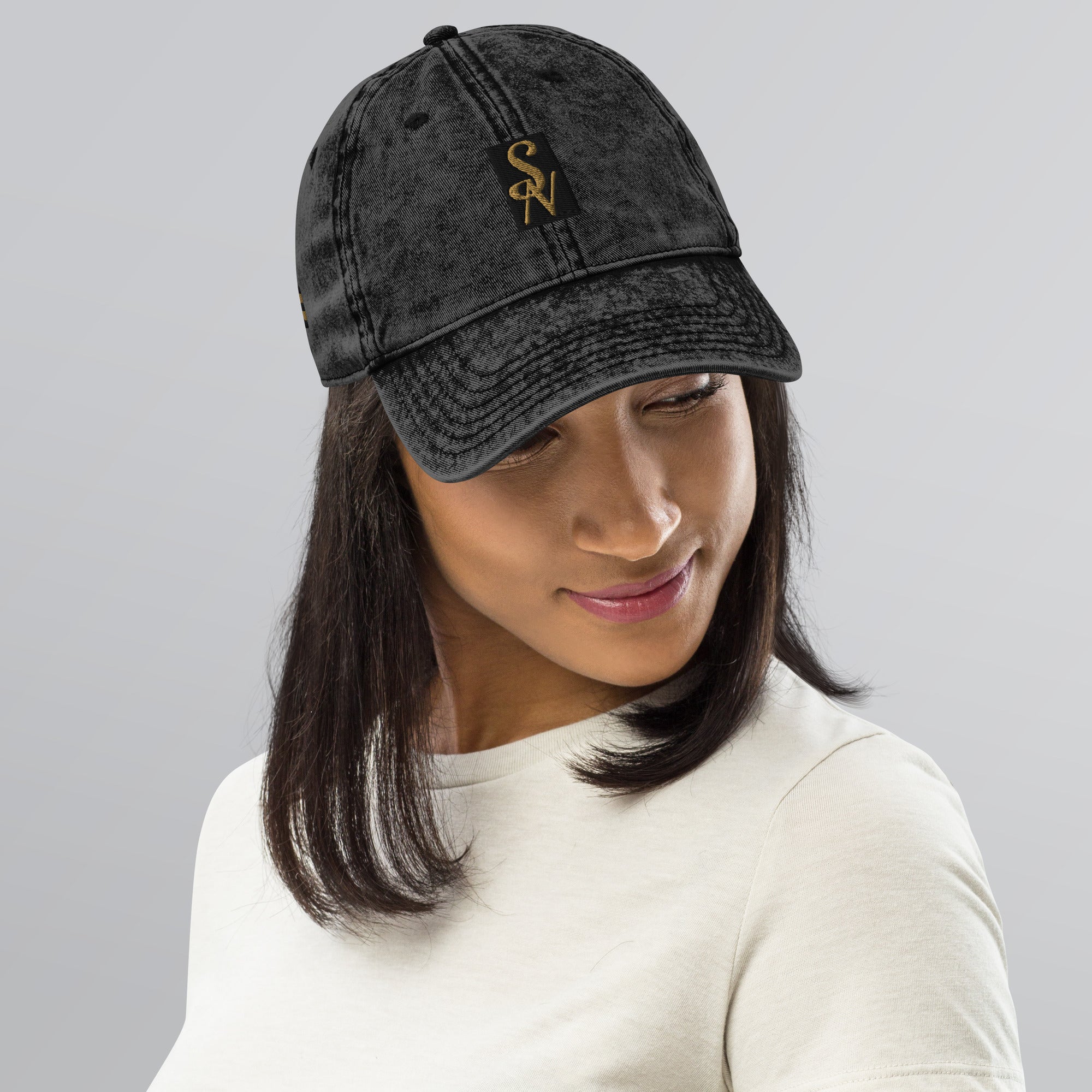 Woman wearing vintage cotton twill cap in black with SAVANT NOIR logo embroidery